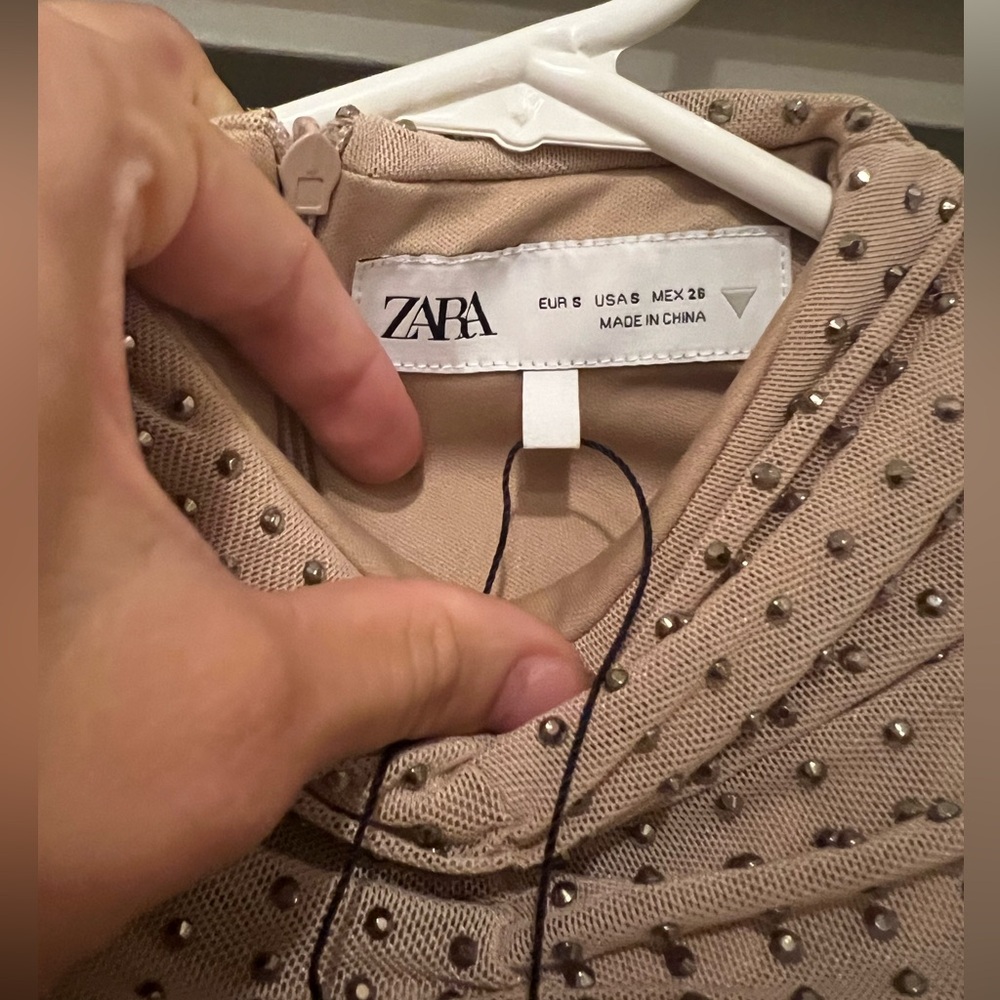 Perfect condition, BNWT although paper fell off. Beautiful sparkle to the dress